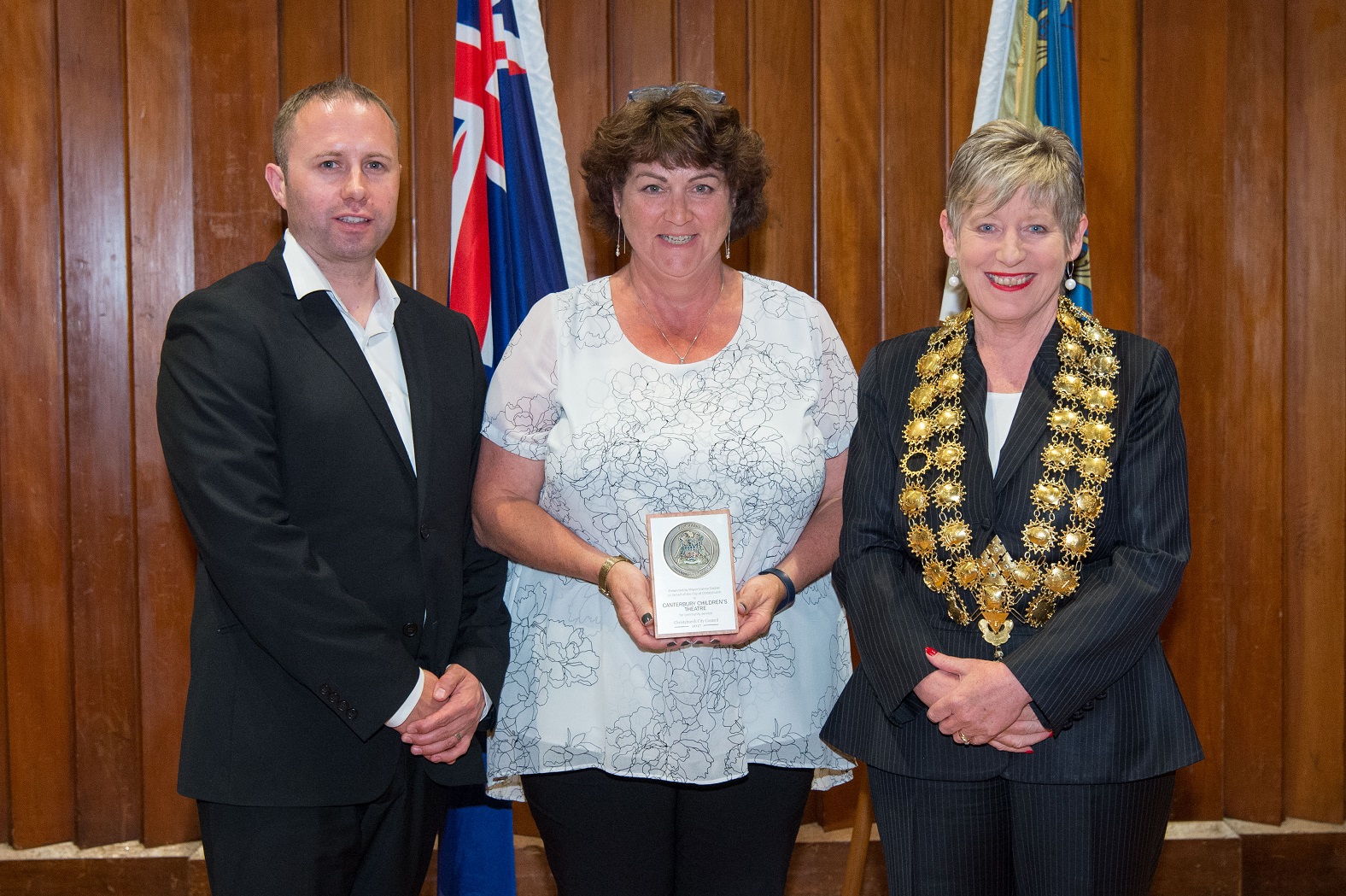 a representative of the Children's Theatre Company receiving the award