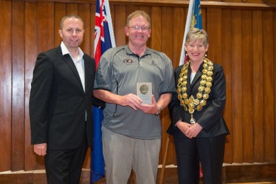 a representative from Parafed receiving the award