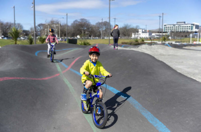 Child on a bike riding the Detour Snake Run